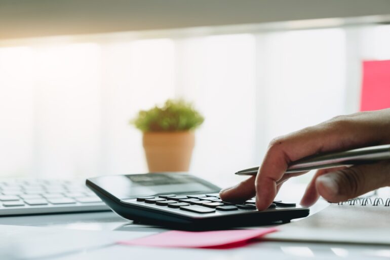 a homeowner calculating their mortgage balance versus the home's value