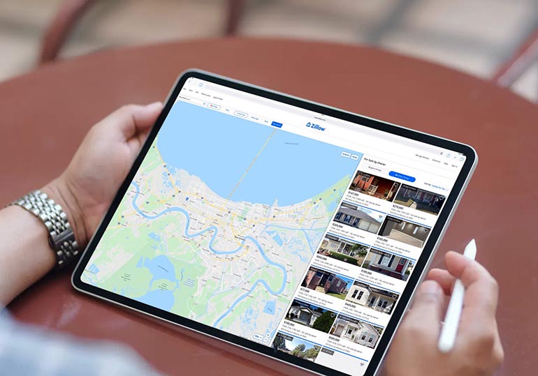 woman checking comps on Zillow