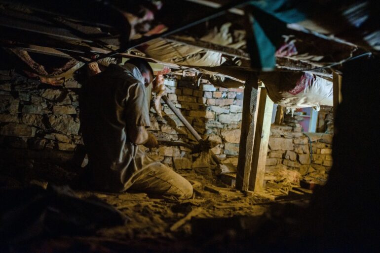 crew repairing a house foundation