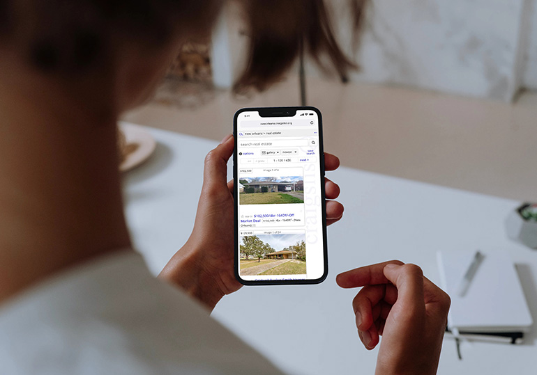 woman viewing homes for sale on Craigslist
